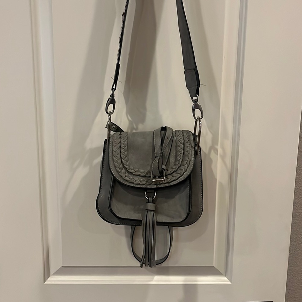 Gray Crossbody Bag with crossbody strap plus additional strap that is tapestry.
